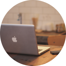 Laptop on desk in a circle